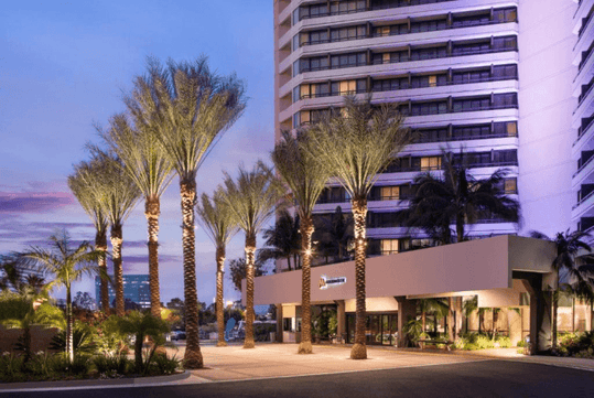 Hotel exterior at dusk.