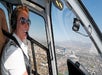 The pilot shares a smile as the pilot flies the helicopter over Las Vegas.