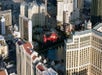 A helicopter flying over the iconic hotels of the Las Vegas Strip.