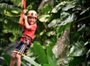 A child ziplining with a smile.