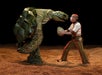 A standing giant turtle and a man at KA Cirque Du Soleil show in Las Vegas, Nevada.