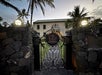 The ornate iron gates guarding Hulihe‘e Palace at dusk.