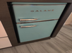 Retro mini fridge inside a guest room.