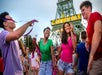Young adults dancing and having a good time at the Carnivale at King's Island in Cincinnati, Ohio.