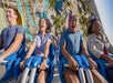Teenagers riding the HangTime roller coaster and screaming at Knott's Berry Farm in Buena Park, California.