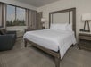 Guest room with one king bed, and a sleeper chair.