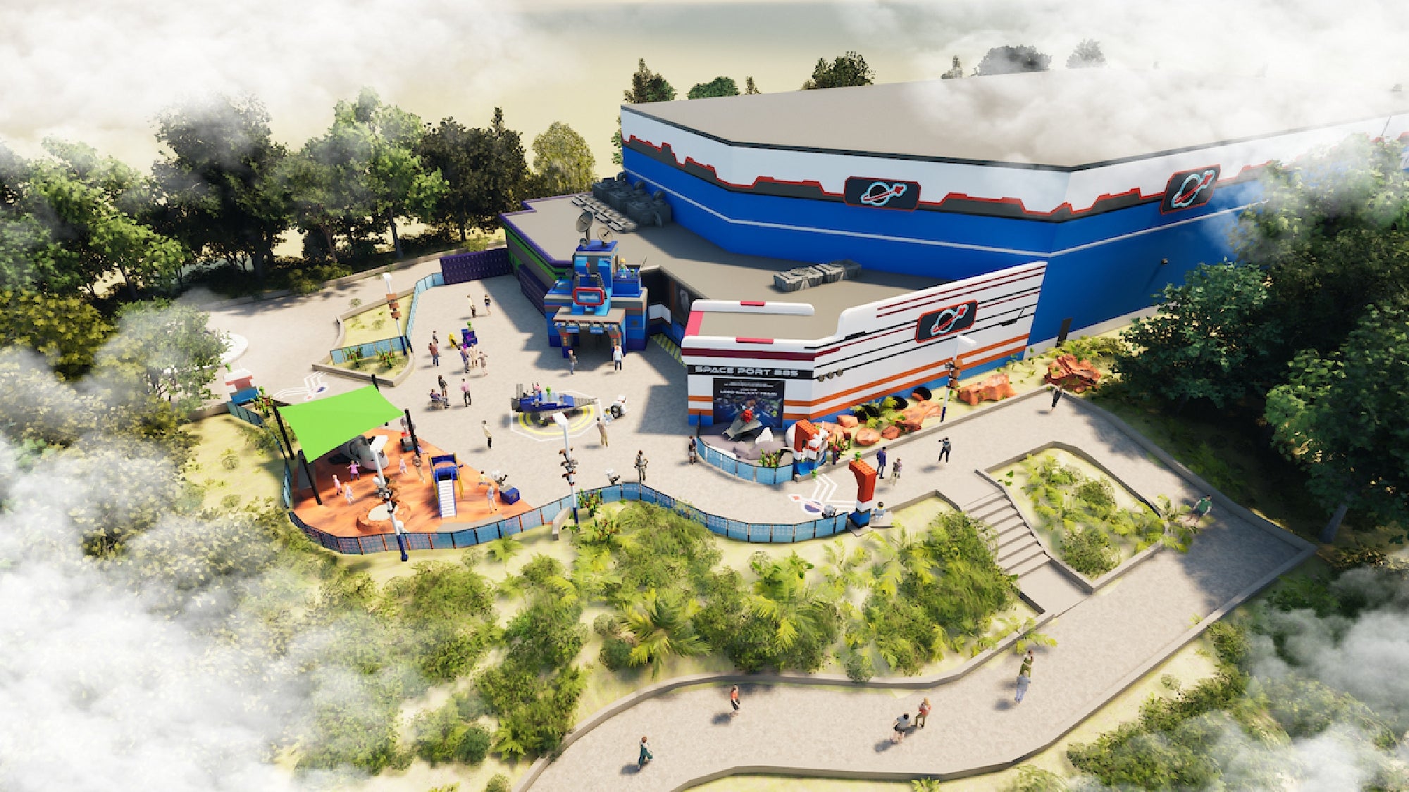 Aerial view of a theme park attraction with a blue and white building, outdoor seating, greenery, and visitors walking around.