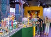 Two parents and two children looking at a large city full of buildings and cars entirely made out of LEGO at LEGOLAND® Discovery Center Atlanta.