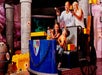A family on a ride shooting toy guns at LEGOLAND® Discovery Center in Columbus, Ohio.