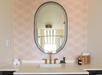 Modern style private bathroom with sink, toiletries, and fresh towels.