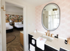 A private bathroom with vanity area and fresh towels.