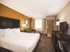 One king bed and a flat-screen TV inside a guest room.
