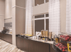 A breakfast buffet with several different options on a white counter top with brown cabinets underneath at the La Quinta by Wyndham Flagstaff.