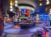 Spacious on-site bar with neon lights.