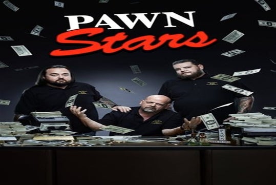 Three men sit and stand behind a desk covered with stacks of cash and paperwork. Dollar bills are flying in the air. The text "PAWN Stars" is prominent at the top.