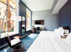 2 Queen beds, flat-screen TV, work desk at Le Meridien Tampa, The Courthouse, FL.