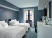 2 Queen beds, flat-screen TV, work desk at Le Meridien Tampa, The Courthouse, FL.
