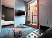 Studio suite, seating area, flat-screen TV, 1 King bed at Le Meridien Tampa, The Courthouse, FL.