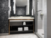 Fresh towels and lighted make-up mirror inside a private bathroom.