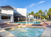 Outdoor hot tub and pool at Legacy Vacation Resorts.