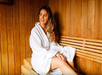 Guest inside a sauna at Legacy Vacation Resorts.