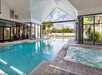 Partially covered swimming pool and hot tub.