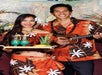 In traditional Hawaiian clothes, cocktails are served and music is played at Rock-A-Hula