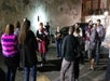 Guests have drinks and take photos in the parking lot.