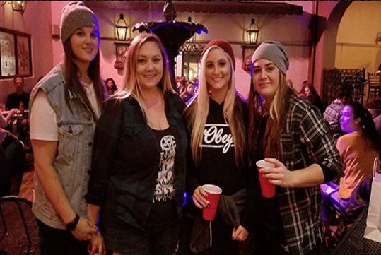 Girls taking picture during bar stop