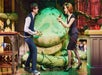Seymour and Audrey standing in front of Audrey 2 talking excitedly in Little Shop of Horrors in New York City, New York.