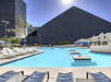 Seasonal outdoor pool with sun loungers.