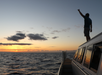 A man enjoying the Luxury Sunset Dolphin Watch & Snorkeling Cruise