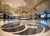 Spacious reception area with a golden lion statue in the middle.