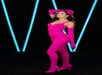 A Dua Lipa wax figure at Madame Tussauds Orlando styled in a custom fuchsia lace catsuit with matching gloves and boots, inspired by the Balenciaga ensemble she wore on her Future Nostalgia tour.