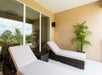 Balcony/patio with lounge chairs.