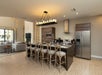 Homes come with full kitchen with bar-height bar stools, kitchen island and modern amenities.