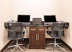 Business center equipped with computers and a printer.