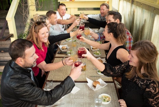 Group cheers at a table