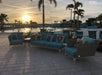 Outdoor pool area at sunset.