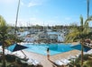 Outdoor pool with waterfront views of the marina.