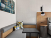 A cozy seating area with a plush sofa, perfect for relaxing.