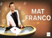 A man in a white jacket stands behind a casino table with playing cards; large text reads "MAT FRANCO" and "The LINQ" logo is visible in the corner.