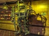 A skeleton in a cage chained to the ceiling with a skull on the chain on display at the Medieval Torture Museum in St. Augustine, Florida.