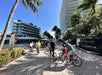 Unlimited Biking tour participants strolling at Miami Beach 