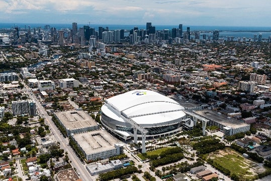 Aerial view of the venue of the loanDepot Park Stadium with the city around it on a sunny day in Miami, Florida.