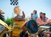 Children laughing while riding Pigpen's Mud Buggies at Michigan's Adventure in Grand Rapids, Michigan.