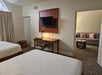 Guest suite with two beds, and a loving area with a sofa bed.