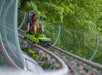 A woman on the ride comes around the corner of the Moonshine Mountain Coaster in Gatlinburg, TN