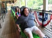 Man in the front of the line on the ride smiles before taking off on the Moonshine Mountain Coaster