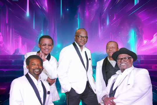Five men in white tuxedo jackets pose and smile in front of a vibrant, neon-lit, abstract background with purple and blue hues.